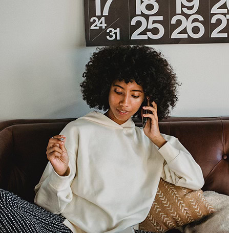 Woman on the phone handling documents